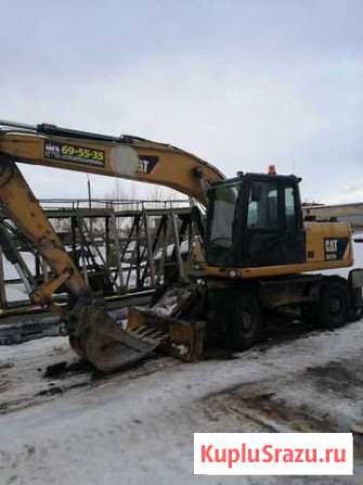 Аренда колесного полноповоротного экскаватора CAT Архангельск - изображение 1